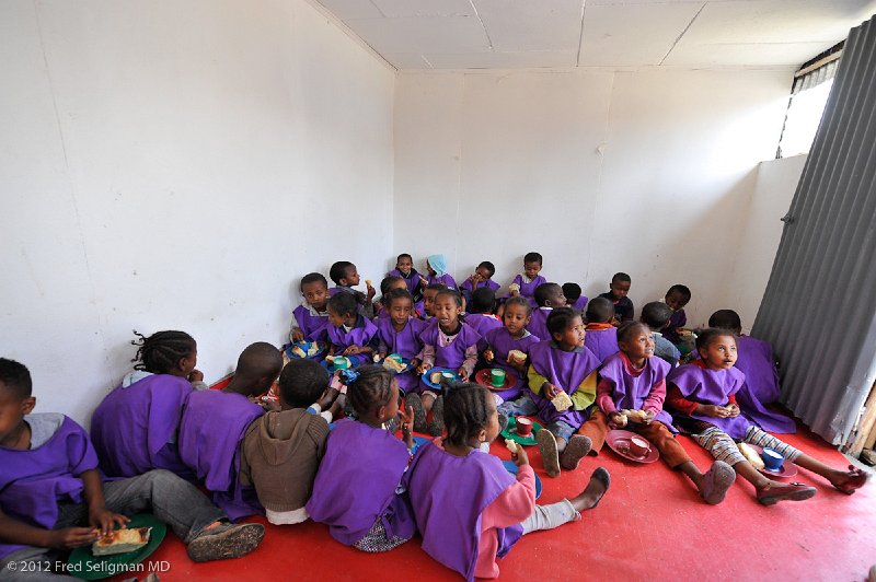 20120327_104229 Nikon D3 2x3.jpg - Snack time, Addis Ababa, Ethiopia.  A good nutritional component contributes to learning.